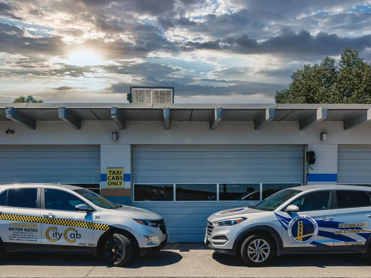 Golden Gate Manor Transportation and City Cab LLC cars next to eachother.